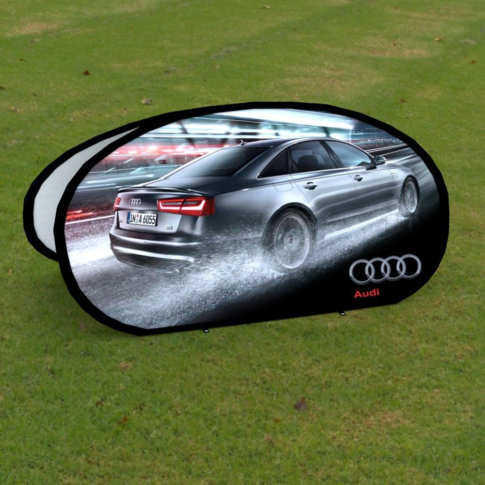 Versatile Oval Pop Out Banner featuring the Audi car in a natural outdoor setting.